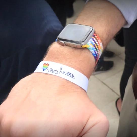 Bracelet with the words 'love is love' on the wrist